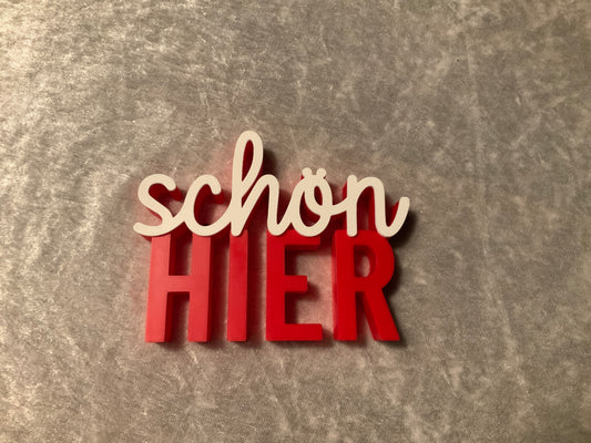 Schriftzug schön hier in Rot Weiß